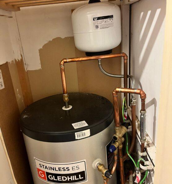 Hot water cylinder and copper pipework installation