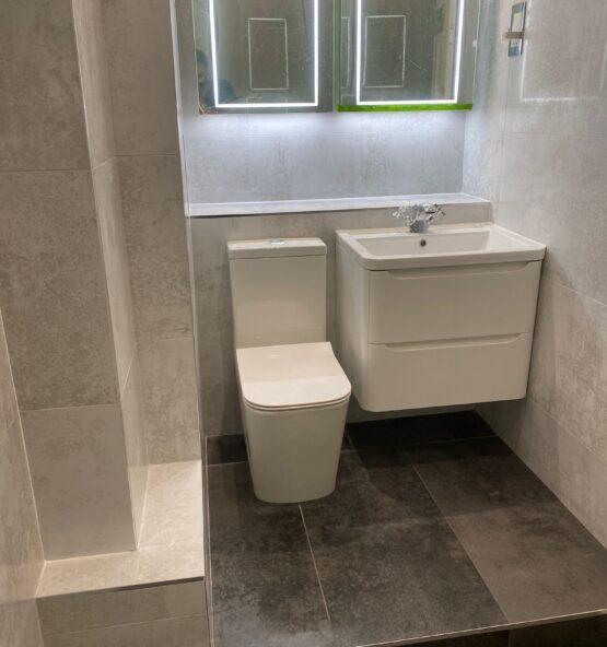 Modern bathroom toilet and vanity installation