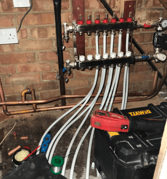 Underfloor heating manifold and pipework installation