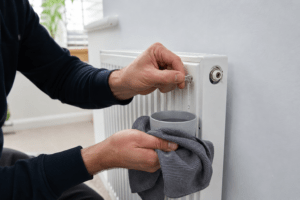 Bleeding a noisy radiator to release trapped air